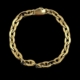 Bracelet en or à maillons sur fond noir