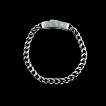 Silver steel chain bracelet on a black background