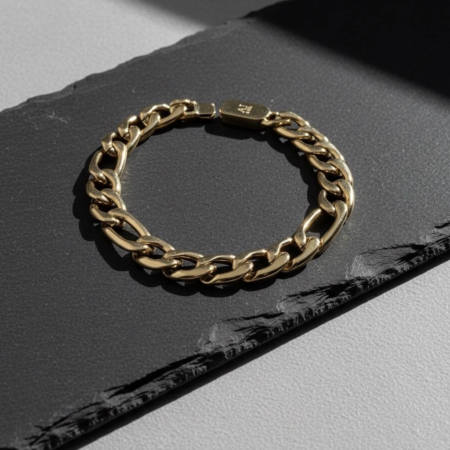 Gold chain bracelet on dark background