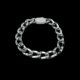 Bracelet chaîne en acier argenté sur fond noir
