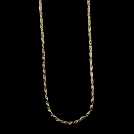 Gold chain necklace on a black background